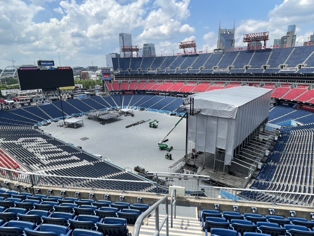 CMA Fest main stage build at Nissan Stadium with Nashville skyline in background